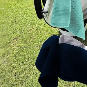 A Golf Towel Does More Than Wipe Clubs